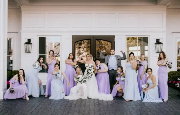 A Waterfront Wedding Featuring The Couple’s Dog & Pride Flags at the Ceremony