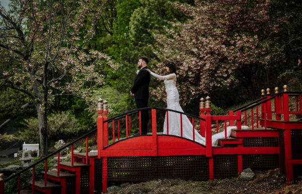 Their First Look Was on a Red Bridge Surrounded by Cherry Blossoms at The Views at Mt Fuji